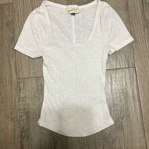 This is a white scoop neck tee with a pretty collar